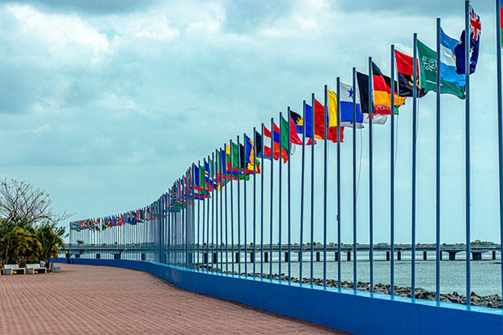 series-of-multination-flags-on-flagpole-by-the-riverside
