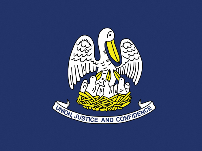 flag-of-louisiana-in-blue-background-with-pelician-and-its-three-babies-in-nest-above-white-ribbon-with-state-motto