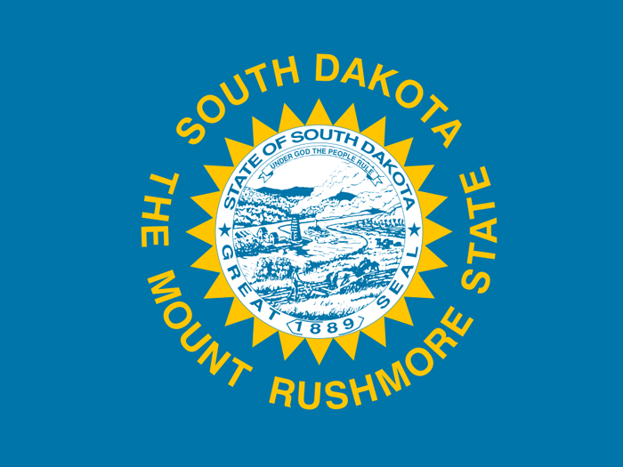 flag-of-south-dakota-in-blue-field-with-state-seal-in-center-encircled-with-name-and-nickname-of-the-state